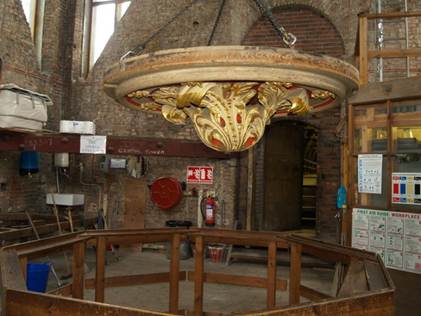 The ornate cover when removed from the hole